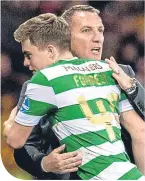  ??  ?? James Forrest with Brendan Rodgers at Hampden last weekend