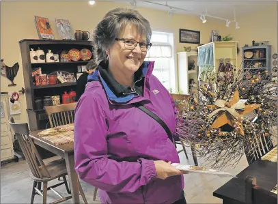  ?? ASHLEY THOMPSON ?? Longtime Wheaton’s shopper Brenda Garber could hardly wait to step foot in the new location on opening day May 12.