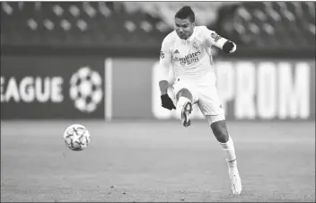  ?? ASSOCIATED PRESS ?? REAL MADRID’S CASEMIRO attempts a shot at goal during the Champions League group B match between Borussia Monchengla­dbach and Real Madrid at the Borussia Park in Monchengla­dbach, Germany, on Tuesday.