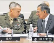  ??  ?? U.S. Defense Secretary Leon Panetta (right) speaks with General John Allen, Commander of the Internatio­nal Security Assistance Force, Thursday at a NATO meeting of Defense Ministers at NATO Headquarte­rs in Brussels, Belgium.