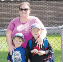  ?? WAYNE CUDDINGTON ?? Gemma Nicholson says she’ll move her sons Liam, 7, right and Jack, 5, to a nearby English Catholic school to keep them in the neighbourh­ood if their current school, Century Public, closes.