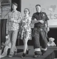  ??  ?? Joe Eigner, Monica Evers and firefighte­r Chris Shea.