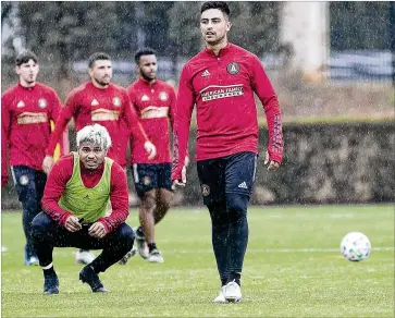  ?? PHOTOS BY ALYSSA POINTER / ALYSSA.POINTER@AJC.COM ?? LEFT: Midfielder Pity Martinez (right) and forward Josef Martinez (left) are seen as part of the Five Stripes’ core. “This year we have Ezequiel Barco, Pity Martinez and Josef Martinez all set,” club President Darren Eales says. “I’m really excited about that core being together.”
RIGHT: Manager Frank de Boer watches the team’s practice at their training facility on Monday.