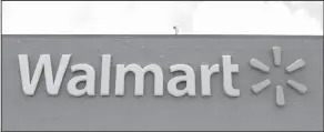  ?? AP Photo/Alan Diaz ?? Name Change: This file photo shows a Walmart store in Hialeah Gardens, Fla. Wal-Mart Stores Inc. is changing its legal name effective Feb. 1, 2018, to Walmart Inc. from Wal-Mart Stores Inc.