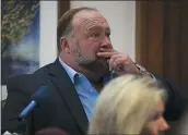  ?? BRIANA SANCHEZ — THE ASSOCIATED PRESS POOL ?? Alex Jones attempts to answer questions about his text messages asked by Mark Bankston, a lawyer for Neil Heslin and Scarlett Lewis, during a trial at the Travis County Courthouse in Austin, Texas, on Wednesday.