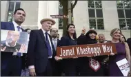  ?? (AP/Gemunu Amarasingh­e) ?? Participan­ts stand for a group photo after unveiling a new street sign for Jamal Khashoggi Way outside the Embassy of Saudi Arabia on Wednesday in Washington.