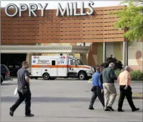  ?? MARK HUMPHREY — THE ASSOCIATED PRESS ?? An ambulance sits outside Opry Mills mall Thursday, May 3, 2018, in Nashville, Tenn. Nashville police said a suspect was taken into custody after a person was shot and killed inside the mall. The mall was evacuated after the gunfire was reported.