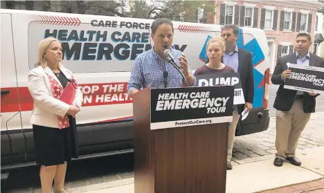  ?? THE MORNING CALL ?? Mitchell Lenett, 55, a Lower Macungie Township resident, talks about the protection­s in the Affordable Care Act that help him and his daughter, Carly, 14, afford treatment for Type 1 diabetes at a press event hosted by U.S. Rep. Susan Wild, D-7th District.