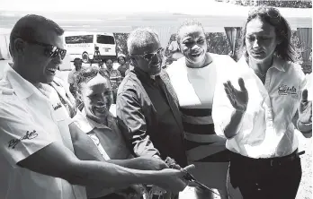  ?? PHOTO BY JANET SILVERA ?? Tyrone Robinson, board chairman of the North East Regional Health Authority (third left), and Adam Stewart (left), president of the Sandals Foundation, cut the ribbon to officially open the refurbishe­d doctors’ quarters at the Port Maria Hospital. Looking on (from left) are Lyndsay Isaacs, regional public relations manager; Fabia Lamm, regional director, North East Regional Health Authority; and Heidi Clarke, director, Sandals Foundation.