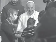  ?? SOLARO/AFP VIA GETTY IMAGES ANDREAS ?? Pope Francis meets with migrants after a prayer service in Nicosia, Cyprus, on Friday. He said countries have a moral obligation to accept those who flee war, hatred and oppression.