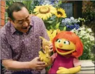  ?? ZACH HYMAN — SESAME WORKSHOP VIA AP ?? This image released by Sesame Workshop shows Julia, a new autistic muppet character debuting on the 47th Season of “Sesame Street,” on on both PBS and HBO.