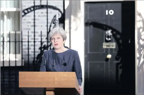  ?? PHOTO: BLOOMBERG ?? British Prime Minister Theresa May announced a general election outside 10 Downing Street in London on Tuesday. May said she would seek an early election on June 8, in an unexpected gamble aimed at strengthen­ing her hand going into talks on Britain...