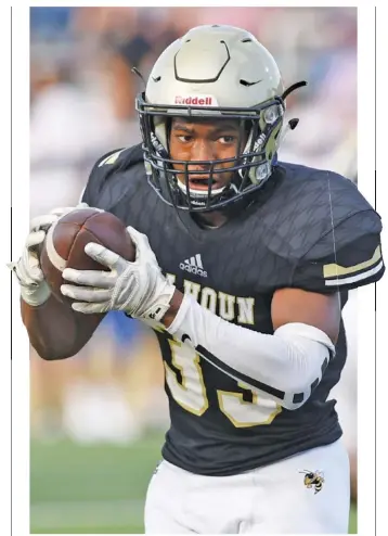  ?? STAFF PHOTO BY ROBIN RUDD ?? Calhoun’s Jerrian Hames looks for running room after catching a pass in the Aug. 9, 2019 preseason scrimmage against the Northwest Whitfield Bruins.