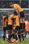  ??  ?? EQUALISER: The U’s celebrate Jabo Ibehre’s goal