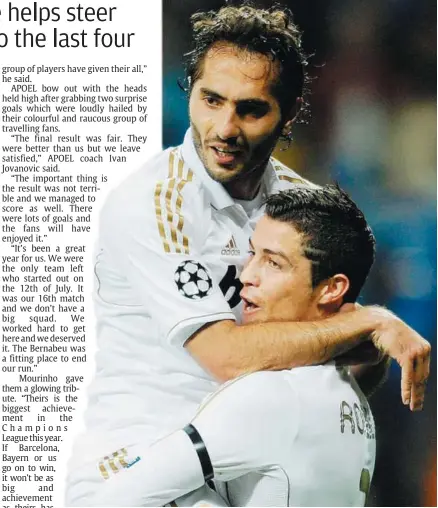  ??  ?? Top act: Real Madrid’s Cristiano Ronaldo (right) hugs team-mate Hamit Altintop after scoring at the Bernabeu on Wednesday. — AFP