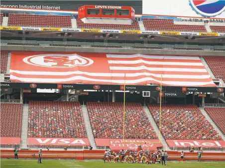  ?? Scott Strazzante / The Chronicle ?? Robbie Gould nails a kick against Arizona — in front of cardboard cutouts in the end zone — in the 49ers’ seasonopen­ing loss.