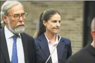  ?? Ned Gerard / Hearst Connecticu­t Media ?? Michelle Troconis leaves Connecticu­t State Police Troop G in Bridgeport after turning herself in to face additional charges in the Jennifer Dulos case on Thursday.