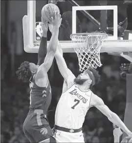  ?? Marcio Jose Sanchez Associated Press ?? TORONTO’S OG Anunoby, left, has his shot blocked by the Lakers’ JaVale McGee during the first half but it was all Raptors, who took a 71-49 halftime lead.