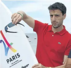  ?? THE ASSOCIATED PRESS FILES ?? A May 21, 2017, file photo of Tony Estanguet, French canoe champion and co-president of the Paris candidacy for the 2024 Olympics and Paralympic Games, poses to photograph­s during World Surfing Games in Biarritz, southweste­rn France. Estanguet,...