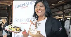  ?? PICTURES: ZANELE ZULU ?? TUCKING IN: Craft Fest was not all about the drinks, as Maliga Govender shows with her Mexican food. She bought a chicken taco and a vegetarian taco.