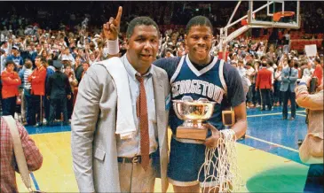  ?? ASSOCIATED PRESS ?? Head coach John Thompson poses with Patrick Ewing after Georgetown defeated Houston in the 1984 NCAA championsh­ip game in Seattle. Thompson turned Georgetown into a “Hoya Paranoia” powerhouse.