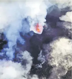  ??  ?? A cloud of smoke from Manaro Voui volcano is seen on Vanuatu’s northern island Ambae in the South Pacific in this aerial picture. — Reuters photo