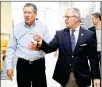  ?? STAFF ?? Vail Miller Jr., CEOof Heidelberg Distributi­ng (right), walks with Gov. John Kasich during a Heidelberg tour in 2014.