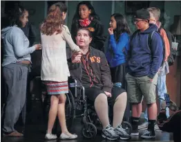  ?? STAFF FILE PHOTO ?? Bryan Stow, middle, the survivor of a traumatic brain injury he suffered when he was attacked in the Dodger Stadium parking lot, meets some students after he delivered his inspiratio­nal anti-bullying message at Hillsdale High School in San Mateo in 2016.