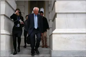  ?? (AP/Patrick Semansky) ?? Democratic presidenti­al candidate Sen. Bernie Sanders, I-Vt., leaves Capitol Hill on Wednesday after the Senate passed a second coronaviru­s response bill.