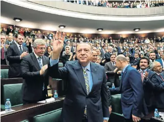  ?? /Kayhan Ozer, AFP Photo ?? Support: President Recep Tayyip Erdogan is applauded after delivering his speech at the Grand National Assembly of Turkey in Ankara on Tuesday.