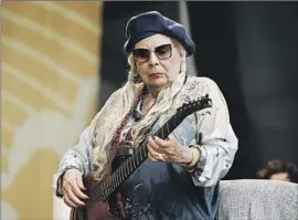  ?? Nina Westervelt Newport Festivals Foundation ?? JONI MITCHELL during her surprise performanc­e Sunday at the Newport Folk Festival. In her lyrics and in her life, she has demonstrat­ed what resilience can be.