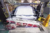  ?? STEVE MARCUS/LAS VEGAS SUN ?? Technical-grade lithium carbonate comes off a conveyor belt during a 2017 tour of the Silver Peak lithium mine near Tonopah, Nevada.