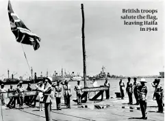  ??  ?? British troops salute the flag, leaving Haifa in 1948