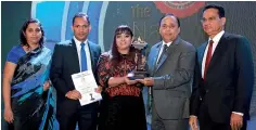  ??  ?? Aitken Spence Hotels team receiving the awards at the 55th Annual Report Awards