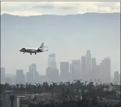  ?? Al Seib Los Angeles Times ?? WIRELESS carriers said they might create exclusion zones around airports. Above, the L.A. skyline in 2019.