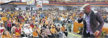  ?? (Photos: Michael Gordon) ?? Pastor Lubert Levy leads the devotional segment of the People’s National Party’s 80th annual conference at National Arena yesterday.