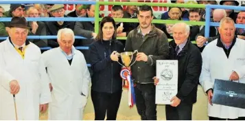  ??  ?? Robert McGivern from Carrigtwoh­ill, exhibitor of the Supreme Champion of the show, receiving the trophy from sponsors Sinead Corkery of Bank of Ireland, Kanturk, with judges Michael Fox, Benny Merrigan and Patrick Hally and chairman of Kanturk Mart,...