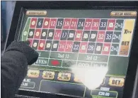  ??  ?? DECISION TIME: The maximum stake for fixed-odds betting terminals could be cut to £2 hitting bookmakers’ profits.