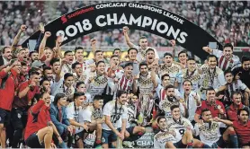  ?? EDURADO VERDUGO THE ASSOCIATED PRESS ?? Chivas players celebrate winning the CONCACAF Champions League final soccer match in Guadalajar­a, Mexico, last April.