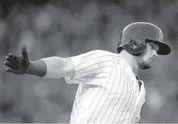  ?? Associated Press ?? Chicago Cubs' Ian Happ celebrates as he rounds the bases after hitting a three-run home run during the fourth inning of a baseball game Sunday against the St. Louis Cardinals in Chicago.