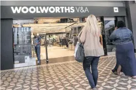  ?? PHOTO: BLOOMBERG ?? Woolworths declares first dividend since the spinoff despite posting a 4.3 percent drop in half-year profit as tough market conditions persist in SA and in Australia.