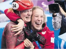  ?? PAUL CHIASSON/THE CANADIAN PRESS ?? Kim Boutin, left, celebrates her bronze in women’s 500-metre short track with Marianne St-Gelais.