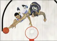  ?? AP PHOTO ?? North Carolina’s Marcus Paige, left, goes up for a shot against Notre Dame’s Zach Auguste during the second half of a regional final men’s college basketball game in the NCAA Tournament, Sunday.