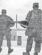  ??  ?? National Guard troops at the Lincoln Memorial look toward the Washington Monument on Wednesday.
MANUEL BALCE CENETA/ AP