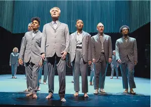  ?? CHARLES SYKES/INVISION/ ASSOCIATED PRESS COURTESY OF HBO ?? David Byrne, foreground, in a scene from “David Byrne’s American Utopia.” The filmed version of the Broadway concert helmed by Spike Lee finds the sweet spot in translatin­g the exhilarati­on of live performanc­e to the screen.