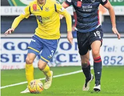  ??  ?? On the ball Scott Tanser against Ross County earlier this month