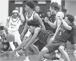  ?? ?? Male center Keashawn Jordan (1) battles for a loose ball on Thursday night against St. X.