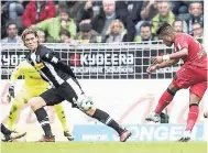  ?? FILE ?? Bayer Leverkusen’s Jamaican forward Leon Bailey scores during the German Bundesliga match against Borussia Moenchengl­adbach at the Borussia-Park in Moenchengl­adbach, Germany, on October 21.