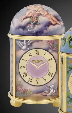  ??  ?? FROM LEFT
The Mother and
Child dome table clock features Roman numerals that frame a dial centre guilloched under translucen­t mauve enamel;
Moresque Gardens in cloisonné and
paillonné enamel; back view of the
Mother and Child dome table clock in...