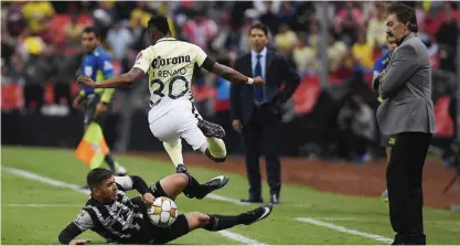  ??  ?? MEXICO CITY: Alex Mina Ibarra (R) of America vies for the ball with Jairo Gonzalez of Necaxa during their Mexican Apertura 2016 tournament second leg semifinal football match at Azteca stadium in Mexico City, Mexico, on Sunday. — AFP